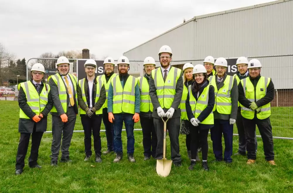 Councillors and partners digging shovel into the ground on Clay Cross Active site
